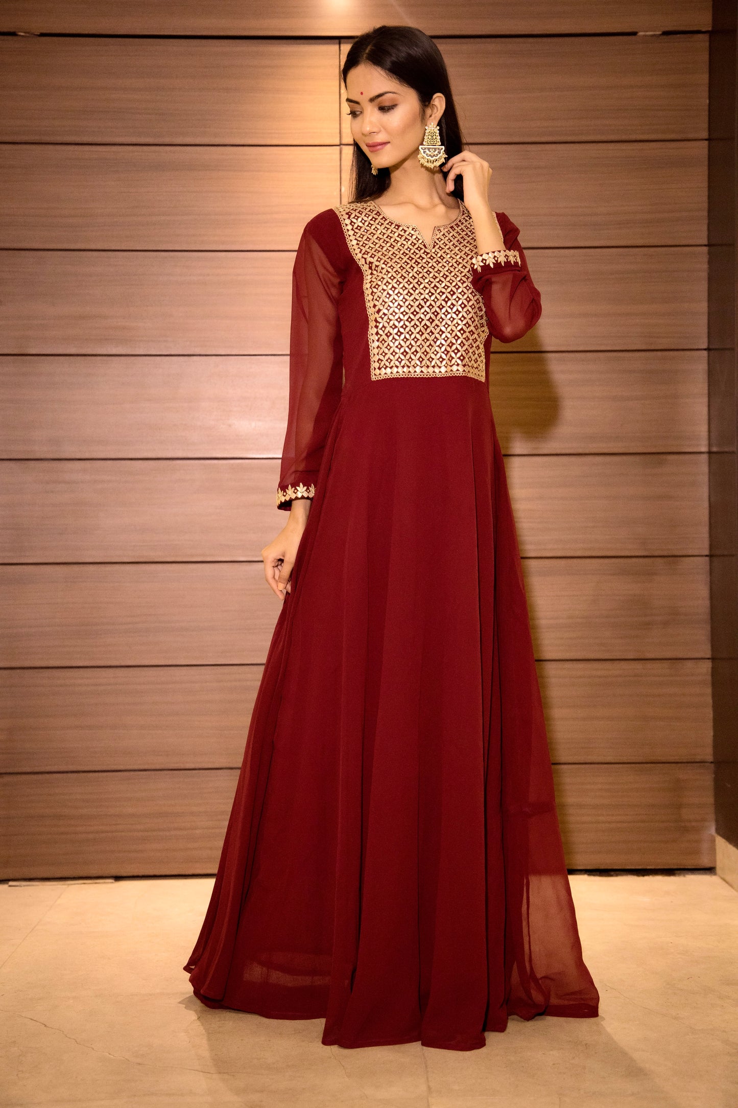 Party wear gown with gota patti hand embellishment.