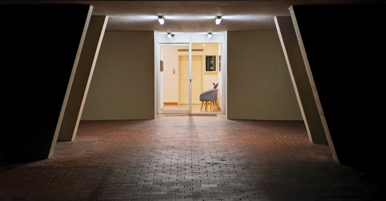 A contemporary building entrance in Hobart, Tasmania, illuminated at night.